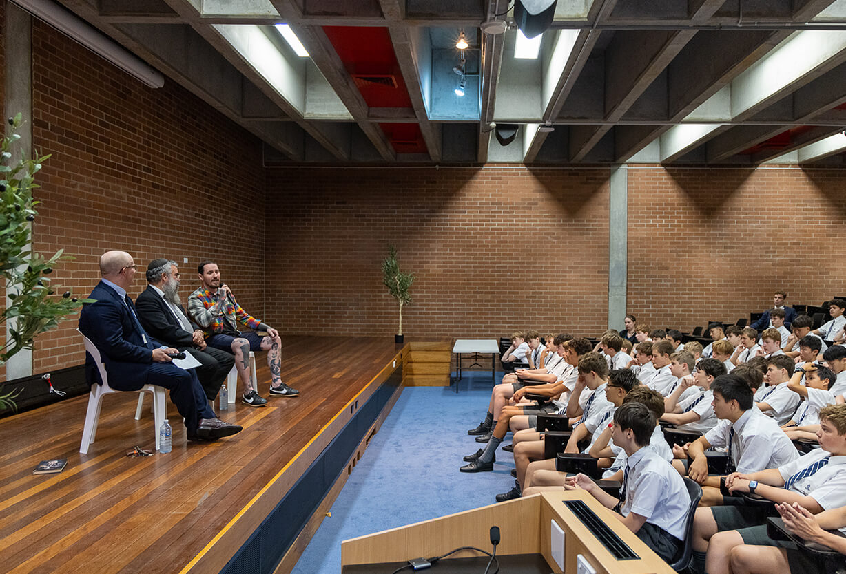 Group of students listening to speakers in a seminar