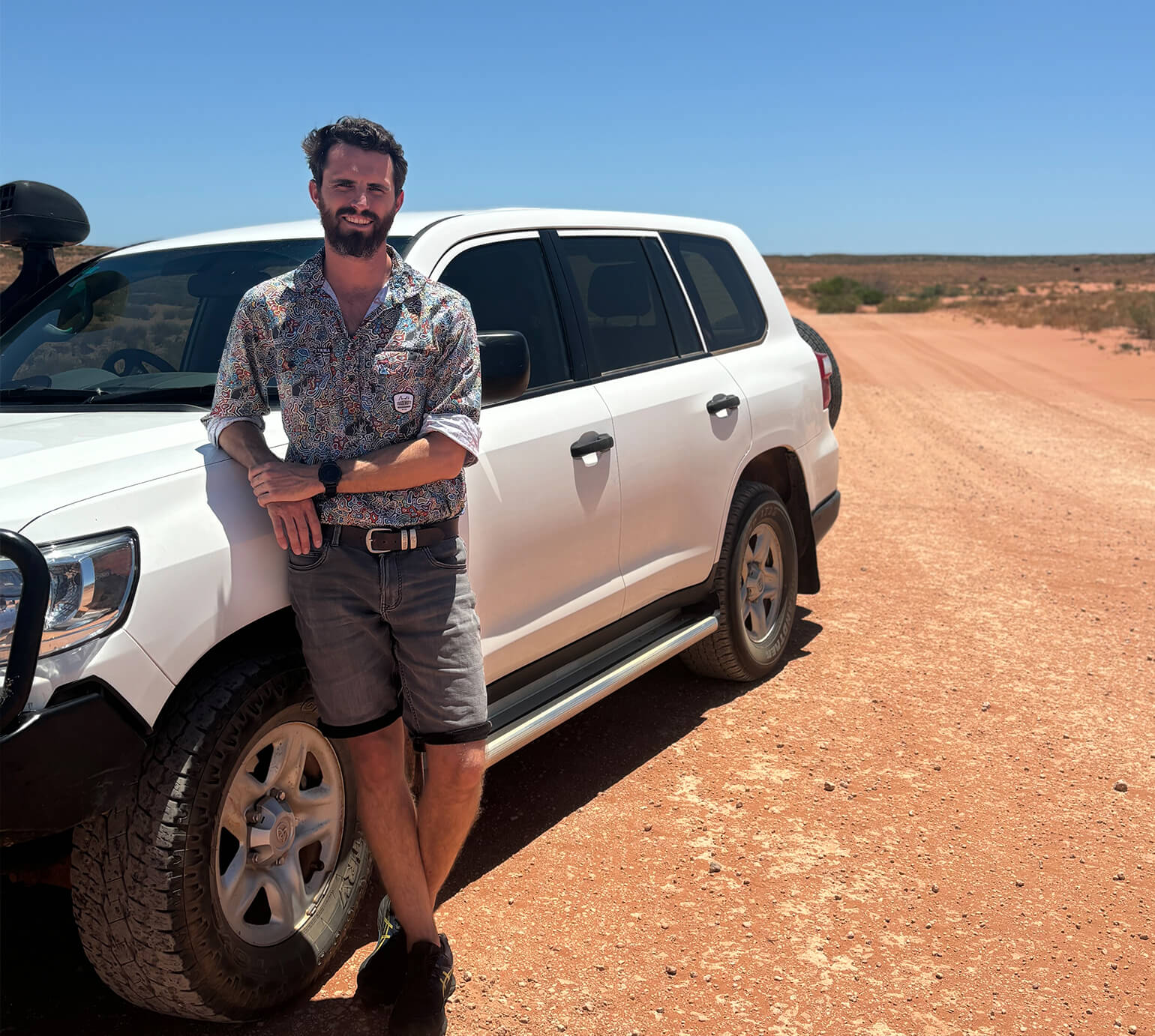 Man standing next to a 4x4